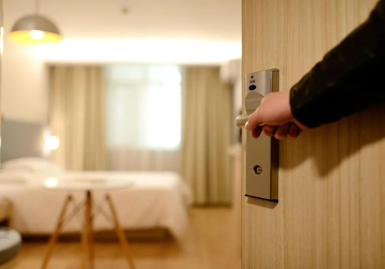 person holding the hotel door in srinagar near dal lake