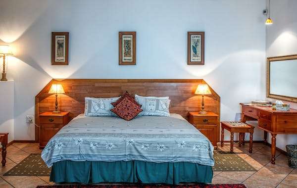 hotel room with bed and furtniture in top hotels in pahalgam